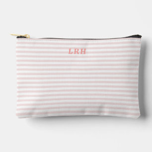 Bolsa de tono rosa melocotón con raya y monograma