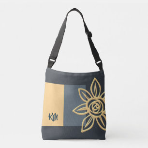 Bolsa monogramada de cuerpo cruzado con una flor e