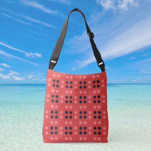 Bolsa transversal con puntos decorativos en rosa y
