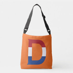 Bolso Cruzado D Monograma sobrepuesto sobre la bandera de la LND