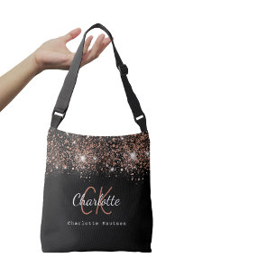Bolso Cruzado Guión monograma de purpurina de oro rosa negro