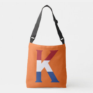 Bolso Cruzado K Monograma sobrepuesto sobre la bandera de la LND