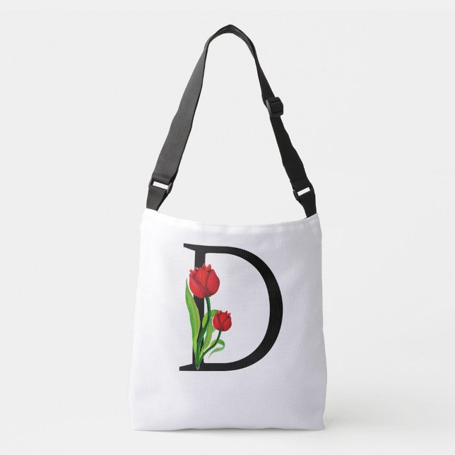 Bolso Cruzado Letra negra negrita "D" (The bag's design is clean and modern, with the tulips adding a touch of nature and color!)