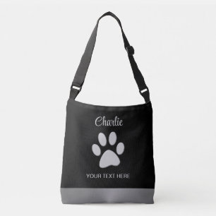 Bolso Cruzado Paw de perro plateado sobre fondo negro