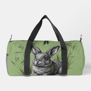 Bolso De Deporte Pequeño Conejito gris lindo entre la hierba