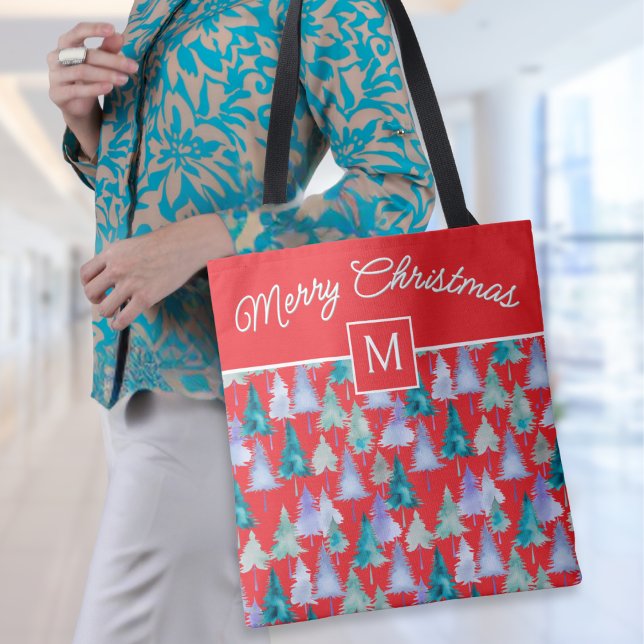 Bolso De Tela Acuarela Árboles navideños Festividad Rojo Monogra (A stylish red tote bag with Merry Christmas words, monogram initial and festive pine trees pattern)