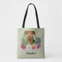 Airedale Terrier y flores de verano coloridas verd