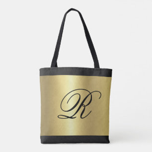 Bolso De Tela Apariencia metálica dorada con monograma