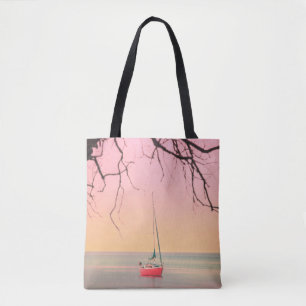 BOLSO DE TELA BARCO ROJO EN LA PLAYA DURANTE EL SOL