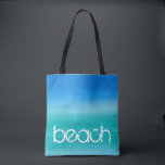 Bolso De Tela Beach Watercolor Ocean Blue Green<br><div class="desc">Este diseño de playa presenta un texto angustiado sobre una acuarela de fondo azul océano y verde. Haga clic en el botón personalizar para ver las opciones para modificar o agregar texto. En nuestra tienda, zazzle.com/store/doodlelulu, podrá encontrar variantes de este diseño, colores adicionales y productos de coordinación. Contáctenos si necesita...</div>