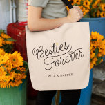 Bolso De Tela Bestis Modern Script Gold Heart Custom Names<br><div class="desc">Este moderno bolso de tote con un minimalista diseño de caligrafía de escritura de moda casual que lee Besties Forever, así como sus nombres personalizados, cuenta con líneas limpias para crear un aspecto elegante y sofisticado. El estilo sobrio con el pequeño detalle dorado del corazón le aporta un toque de...</div>