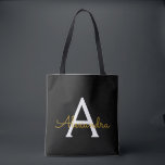 Bolso De Tela Black Name Gold Girly Script Monograma moderno<br><div class="desc">Elegante negro y dorado añade tu propio nombre bolsa de libros monograma. Esta Bolsa de Libros puede ser personalizada para incluir su nombre inicial y de pila y entregarse como regalo para Navidades,  Dulce 16 Cumpleaños,  Ducha de Novias o un Boda.</div>
