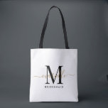 Bolso De Tela Bridesmaid Gift Gold Monograma Blanco<br><div class="desc">Esta bolsa de tocador de la dama de honor presenta un monograma de tipografía manuscrita en blanco y negro con toques en un fondo polvoriento rosa. Presenta a tus damas de honor un tote para llevar objetos el día del boda, y tradicionalmente se presentan en la cena de ensayo o...</div>