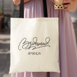 Bolso De Tela Bridesmaid Personalized Name<br><div class="desc">A clean script “Bridesmaid” design paired with a custom name gives this bag a simple,  modern bridal party look. The minimal lettering works well for bachelorette trips,  wedding prep,  or day-of essentials. Add a name to create a personalized keepsake for each bridesmaid.</div>