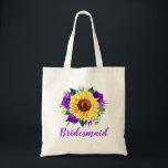 Bolso De Tela Bridesmaid Sunflower Morado Rosa Floral<br><div class="desc">Esta mochila de tote de la dama de honor cuenta con un girasol acuarela y un diseño floral de rosas morados. Puede personalizarlo con un nombre. Visita nuestra tienda o nuestras páginas de colección para ver más productos con este diseño que puedes personalizar para tus necesidades.</div>