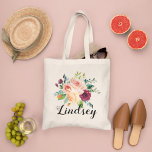 Bolso De Tela Burgundy Pink Floral Bouquet Bridesmaid Name<br><div class="desc">Custom wedding tote bag features a stylish rustic monogram in script writing with a boho floral bouquet design with beautiful fall watercolor flowers, including roses, dahlias, peony flowers, and greenery, in a gorgeous autumn palette of burgundy red, golden yellow, peach orange, blush pink, and shades of green. Personalize with a...</div>