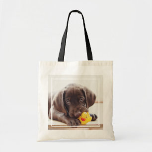 Bolso De Tela Cachorro de chocolate con pato de juguete