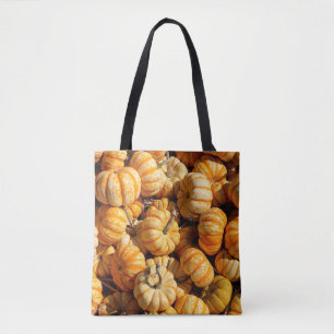 Bolso De Tela calabazas pequeñas en la pila