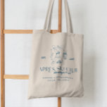 Bolso De Tela Champagne con hielo | Après Ski Winter Bachelorett<br><div class="desc">Celebra tu fiesta de soltera con estilo con estas bolsas de moda Après Ski, perfectas para escapadas de invierno y aventuras nevadas. Con un diseño elegante y lúdico con esquís cruzados, flautas de champán y copos de nieve, estos totes le dan un toque de lujo a sus celebraciones relacionadas con...</div>