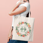Bolso De Tela Coral Pink Floral Greeneration Monograma Wreath<br><div class="desc">El magnífico diseño de la bolsa de personalizado floral con tote presenta hermosas flores acuarelas y vegetación en una corona redonda que enmarca el nombre del monograma personalizado y el inicial. Los colores incluyen rosa oscuro, naranja de coral, flores amarillas y violetas con sabio exuberante y follaje verde oscuro y...</div>