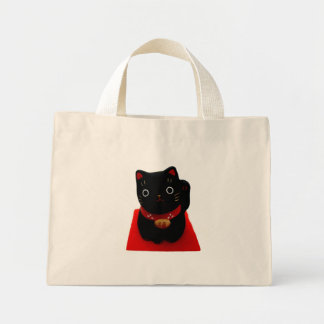 Bolso De Tela Diminuto Maneki Neko negro en una alfombra roja