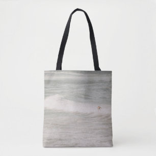 BOLSO DE TELA DOS PERSONAS SOBREVIVIENDO EN OLAS MARÍTIMAS DURAN