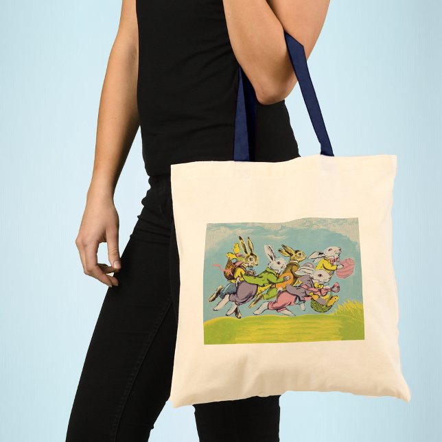 Bolso De Tela Easter Running Pastel Rabbits (Group Easter bunnies running in grass baskets coloured eggs blue sky clouds on tote bag for Easter.)