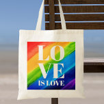 Bolso De Tela El amor es el orgullo del amor<br><div class="desc">Esta Bolsa de Tote Orgullo está decorada con LOVE IS LOVE en letras blancas en negrita sobre un fondo de arcoiris color agua de rojo,  naranja,  amarillo,  verde,  azul y morado. Acuarela original © Michele Davies.</div>