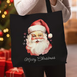 Bolso De Tela El retro vintage Santa Claus Black Merry Christmas<br><div class="desc">Lleve consigo el espíritu de las vacaciones dondequiera que vaya con esta bolsa de tocador retro vintage de Santa Claus. Con un clásico ilustracion de Santa sobre un fondo negro con las palabras "Feliz Navidad", esta bolsa de té es perfecta para viajes de compras festivos, regalos de vacaciones o para...</div>