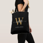 Bolso De Tela Elegante Guión Girona de Oro Negro Monogramado<br><div class="desc">Monograma de color negro y oro simple elegante Personalizado de escritura de señas personalizadas Tote Bag. Este diseño presenta su nombre de pila en una tipografía (o caligrafía) con tipografía de tipo de letra cruz con letras de bonito, con nombre inicial y familiar o nombre completo en oro y blanco...</div>