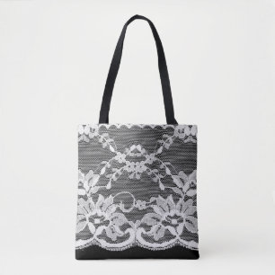 Bolso De Tela Encaje floral blanco sobre fondo negro.