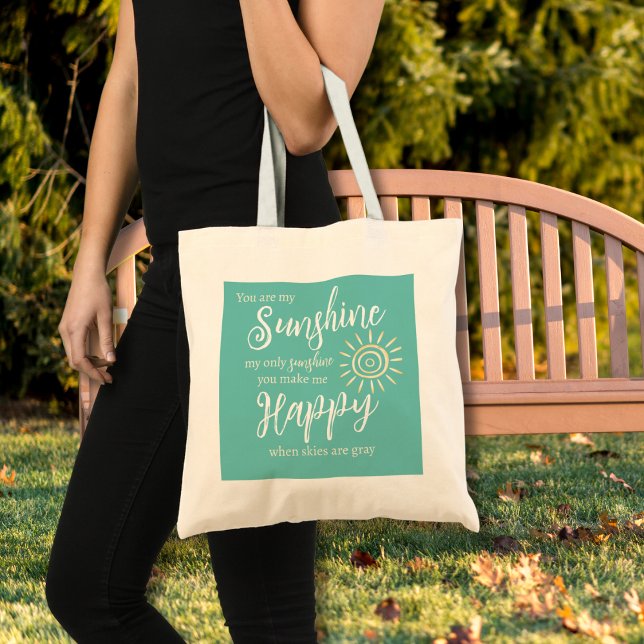 Bolso De Tela Eres Mi Sol Háganme Feliz Verde azulado Sol Azul (You Are My Sunshine You Make Me Happy song lyrics on a teal blue background with yellow sun tote bag)