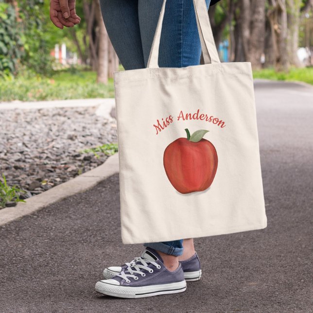 Bolso De Tela Escuela de profesores de Apple (Personalized teacher tote bag with red apple illustration and custom teacher name design.)