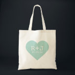 Bolso De Tela Favor de la boda del monograma cardíaco<br><div class="desc">La grafía ondulada de las niñas diseño moderno de forma cardíaca con las iniciales personalizadas del monograma de la novia y el novio y la fecha de boda personalizada. Perfecto para el favor de la boda, bolsos de té, El día de San Valentín, regalo de aniversario o cualquier ocasión! Haga...</div>