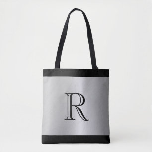 Bolso De Tela Fondo con apariencia metálica plateada con monogra