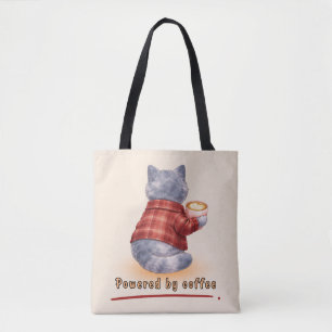 Bolso De Tela Gato "Impulsado por Café" sosteniendo una taza de