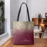 Bolso De Tela Girly Monograma Glam Purpurina de oro de Borgoña<br><div class="desc">Bolsa de libros elegante en monograma dorado y burdeos de burdeos y Purpurina. Esta Bolsa de Libros puede ser personalizada para incluir su nombre inicial y de pila y entregarse como regalo para Navidades,  Dulce 16 Cumpleaños,  Ducha de Novias o un Boda.</div>