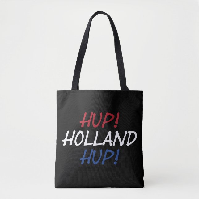 Bolso De Tela Hup Holland colgado sobre la bandera de la NLD en  (Anverso)