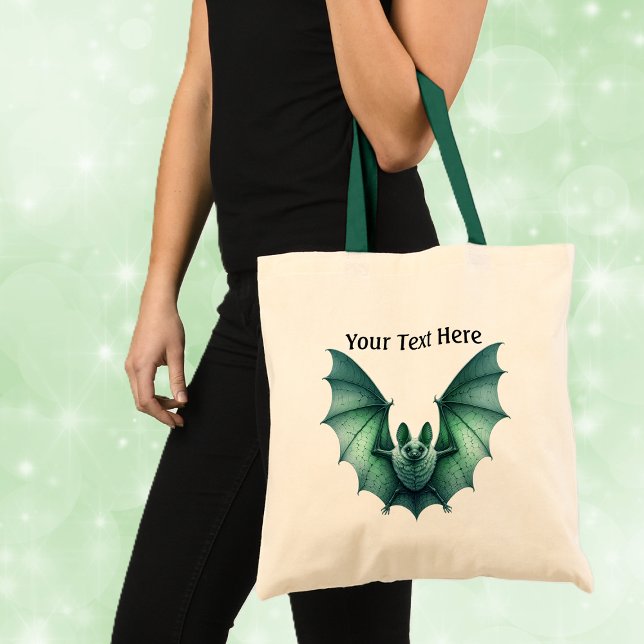 Bolso De Tela Las espeluznantes y góticas alas verdes de los mur (Spooky Gothic look green furry bat with spread wings on white tote bag with green handles.)