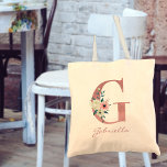 Bolso De Tela Letra floral G rosa e marfil Bouquet<br><div class="desc">Bolsa de tetas personalizada con su monograma - nombre e inicial. La letra floral G está diseñada en purpurina rosa rosa y decorada con un ramo de marfil y rosa de flores acuáticas y vegetación. La plantilla está configurada para que agregue su nombre en un guión con letras de color...</div>
