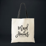 Bolso De Tela Maleta de honor de la doncella de la mano negra<br><div class="desc">Bolsa de tetas moderna y clásica con escritura negra MAID OF HONOR grabado a mano. Personalice agregando el nombre de los receptores o la etiqueta del boda. Perfecto como regalo para tu fiesta nupcial o nupcial.</div>