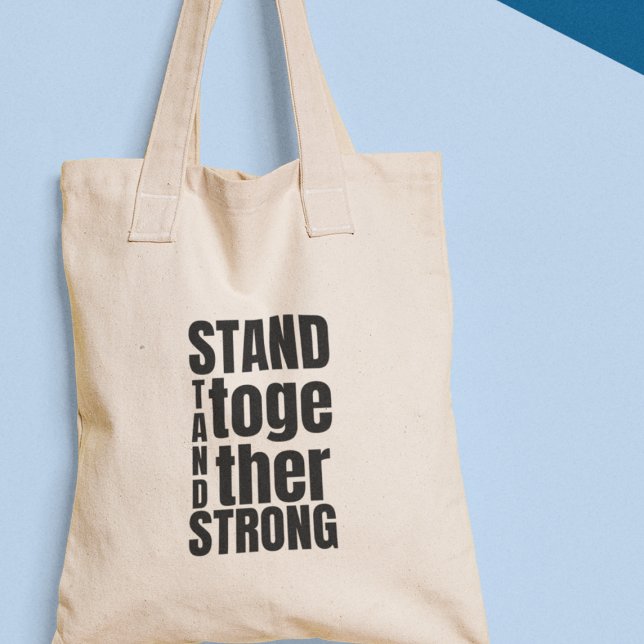 Bolso De Tela Manténganse Unidos, Manténganse Fuertes Unidad por (Get your "Stand Together Stand Strong" tote bag today and wear your values with pride!)
