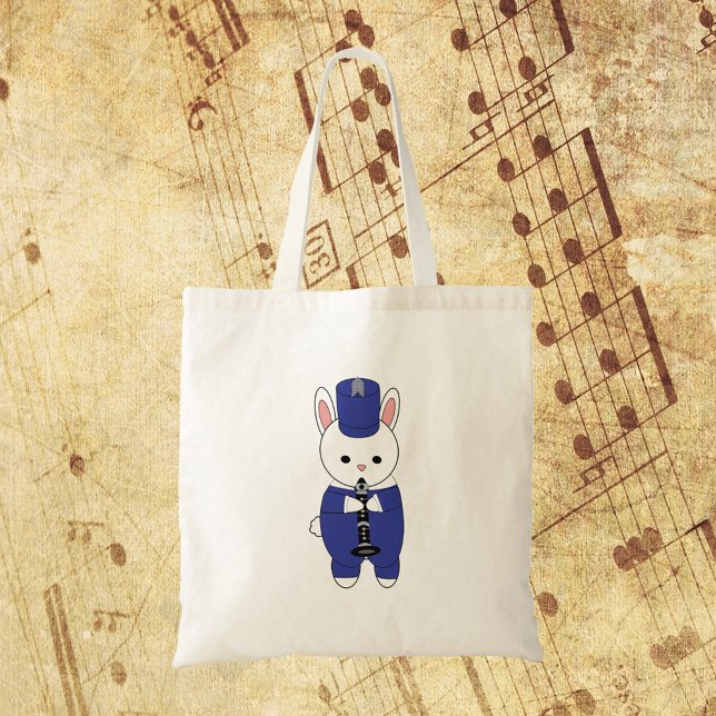Bolso De Tela Marcando Conejo de Banda Clarinet Blanco Azul (A tote bag with a bunny rabbit playing the clarinet in a blue and white marching band uniform.)