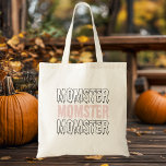 Bolso De Tela Momster Pink Halloween Cute & Spookie!"<br><div class="desc">¡Lleva tus artículos esenciales de Halloween con estilo con nuestra bolsa de té "Momster" de Halloween rosa! Perfecto para las mamás que adoran abrazar la espeluznante temporada con un toque de humor, esta bolsa de tetas presenta el juguetón diseño "Momster" con letras atrevidas y espeluznantes sobre un vibrante fondo rosado....</div>
