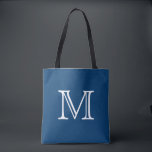 Bolso De Tela Monograma blanco azul náutico<br><div class="desc">¡Este tote está seguro de sentir bien a un favorito! Diseñado en un tono hermoso del azul náutico, la esta bolsa de asas se puede modificar para requisitos particulares con un monograma o una inicial de su opción. Hace un gran tote para la playa, vacaciones, viaje, libros, artes, o para...</div>