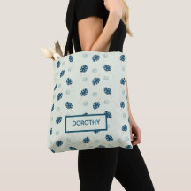 Monstera tropical deja monograma en azul