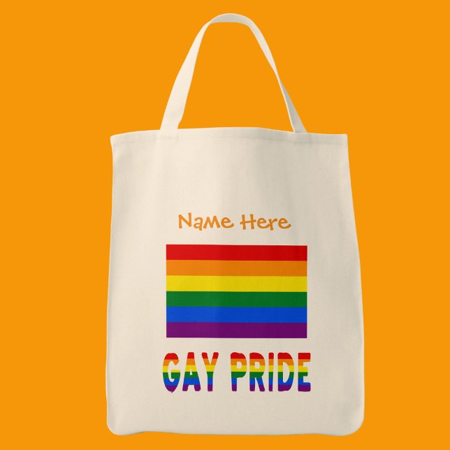 Bolso De Tela Naranja de bandera arcoiris del orgullo gay person (Tote bag has the Gay Pride Rainbow Flag with words GAY PRIDE below in flag colors. Add a name above.)