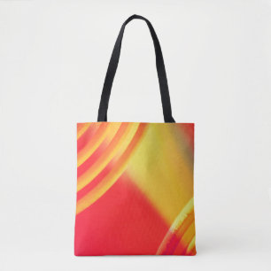 Bolso De Tela Patrón circular amarillo y naranja en un tote