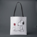 Bolso De Tela Peanuts | Snoopy & Woodstock Red & Black<br><div class="desc">Bring the timeless charm and heartfelt friendship of Peanuts' Snoopy and Woodstock into your life with this delightful collection, featuring their iconic red flower moment. This classic illustration captures Woodstock sweetly presenting a flower to his best pal, making every item in this collection a pure joy to own or gift!...</div>