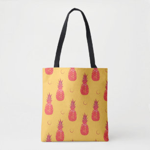 Bolso De Tela Piña rosada sobre fondo naranja. Manto sin foco